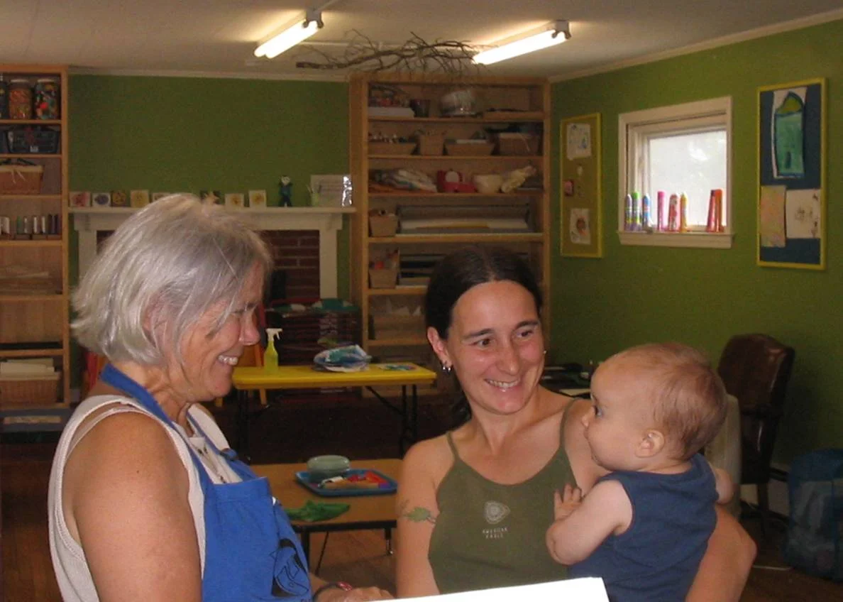 Playhouse Visitor Services Manager Kay Philipp admires Kristi Frederberg's baby.jpg
