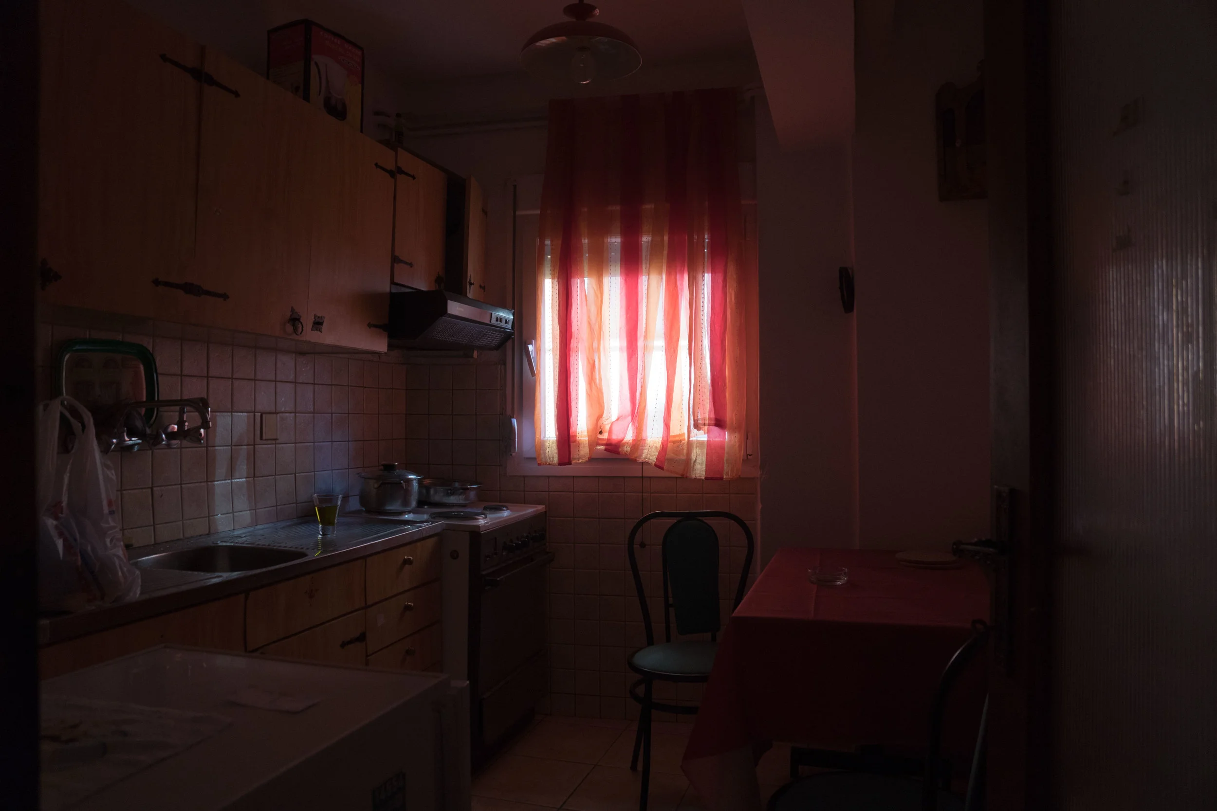 kouzinaa glass of olive oil &amp; an ashtray, two defining items of greek culture, in the kitchen of my stay at the base of mt. olympus in litchoro.