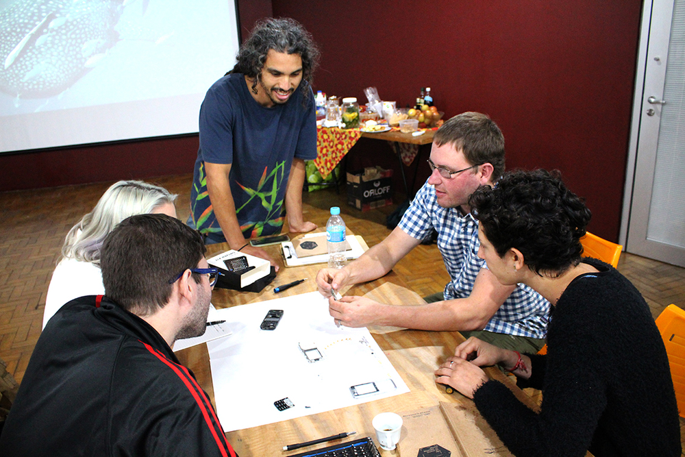 Kyle explains some tricky design work as one team does a tear down