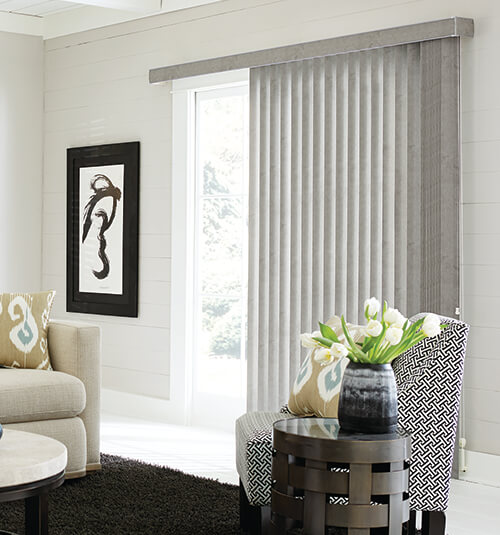 VERTICAL BLINDS Vertical Blinds can be used in all areas of the home, and are a particularly popular choice for screening sliding glass doors or large windows. Vertical Blinds are easy to operate. This versatile product can stack to the left, the right, or even be split down the centre. A beaded chain is used to tilt the blades, allowing you to have complete control of privacy and direction of light. Choose from a number of colours, patterns and designs, then pick your fabric. At Ellis Design Blinds we offer translucent, dimout and blockout fabrics, and can help you to choose which type of material will suit your space the best. 