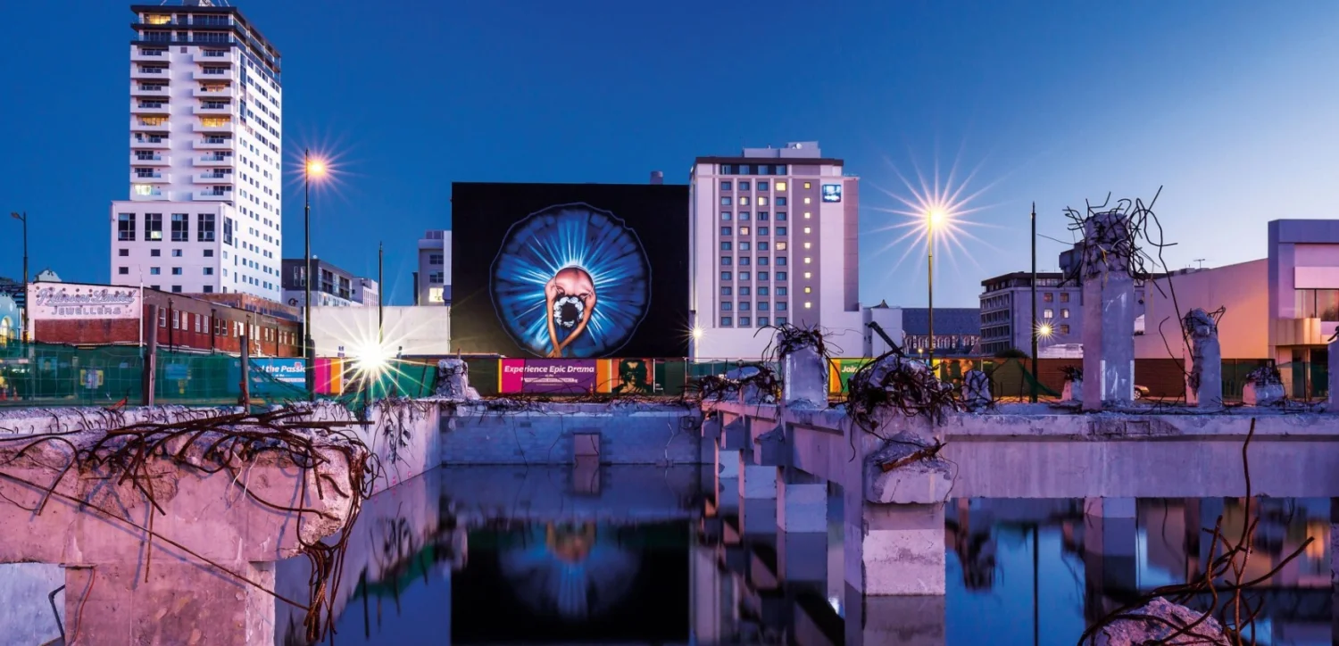 Owen Dippie's Ballerina on the back of the Isaac Theatre Royal became an icon of the re-emerging city. image NZ Geographic. 