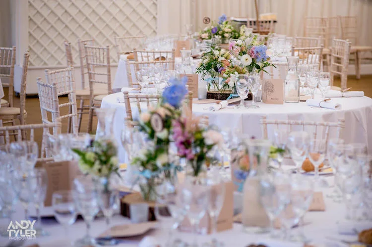 Tables were filled with flowers and tea lights placed on log slices.....