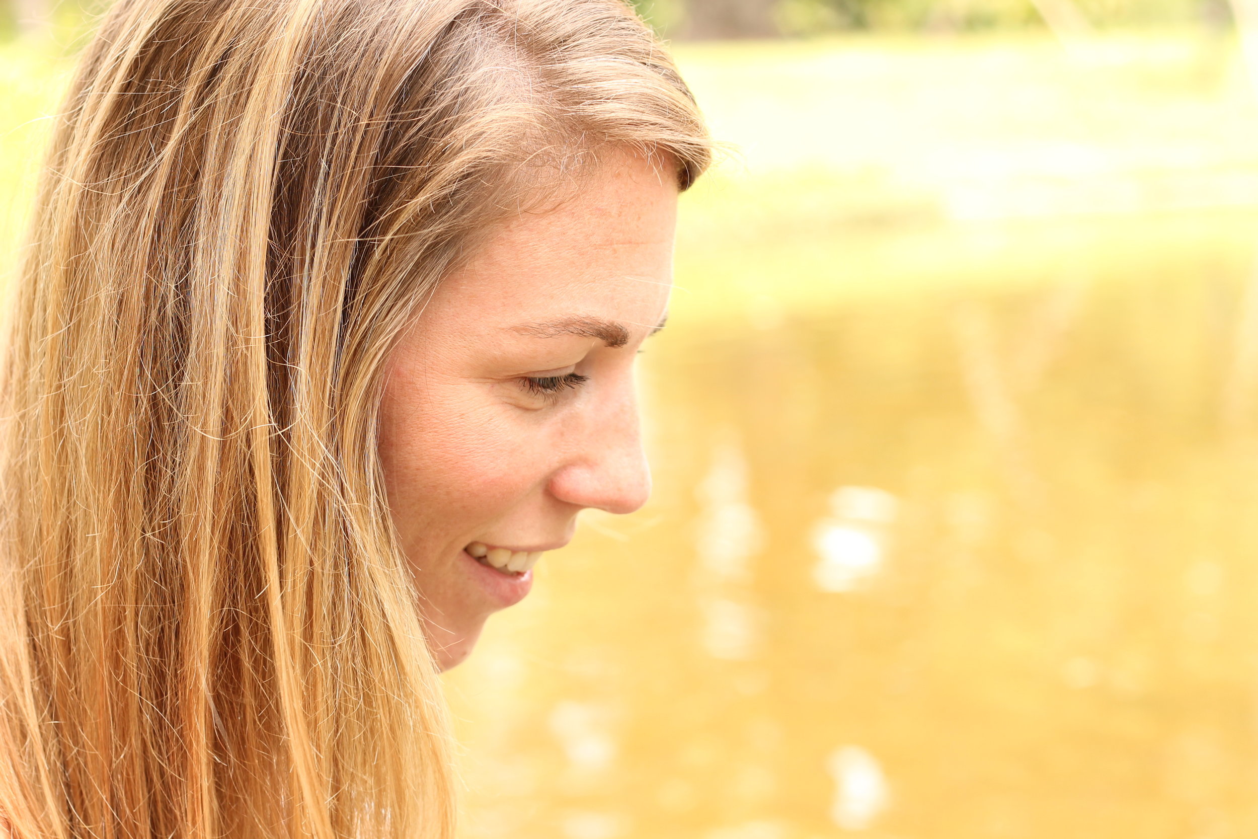 Kelsey Konsen smiling yoga side profile