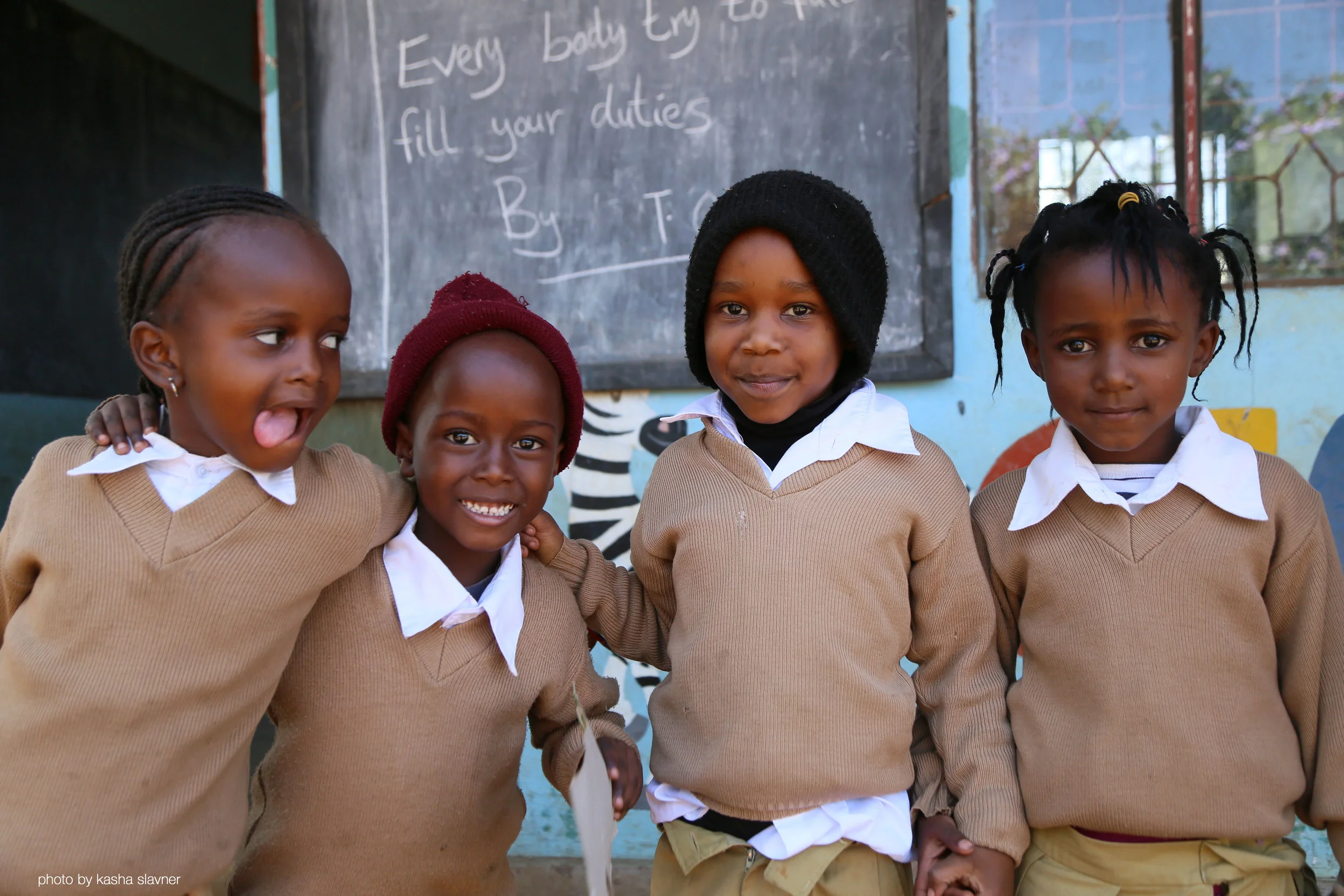 Above: Four friends at Gloryland Prep School, Tanzania.