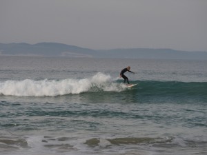 Local surfer riding the waves in Jbay