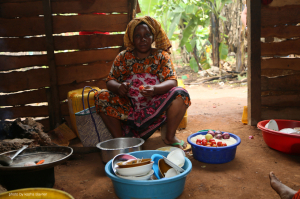 woman in her outdoor kitchen who lives on the spice farm