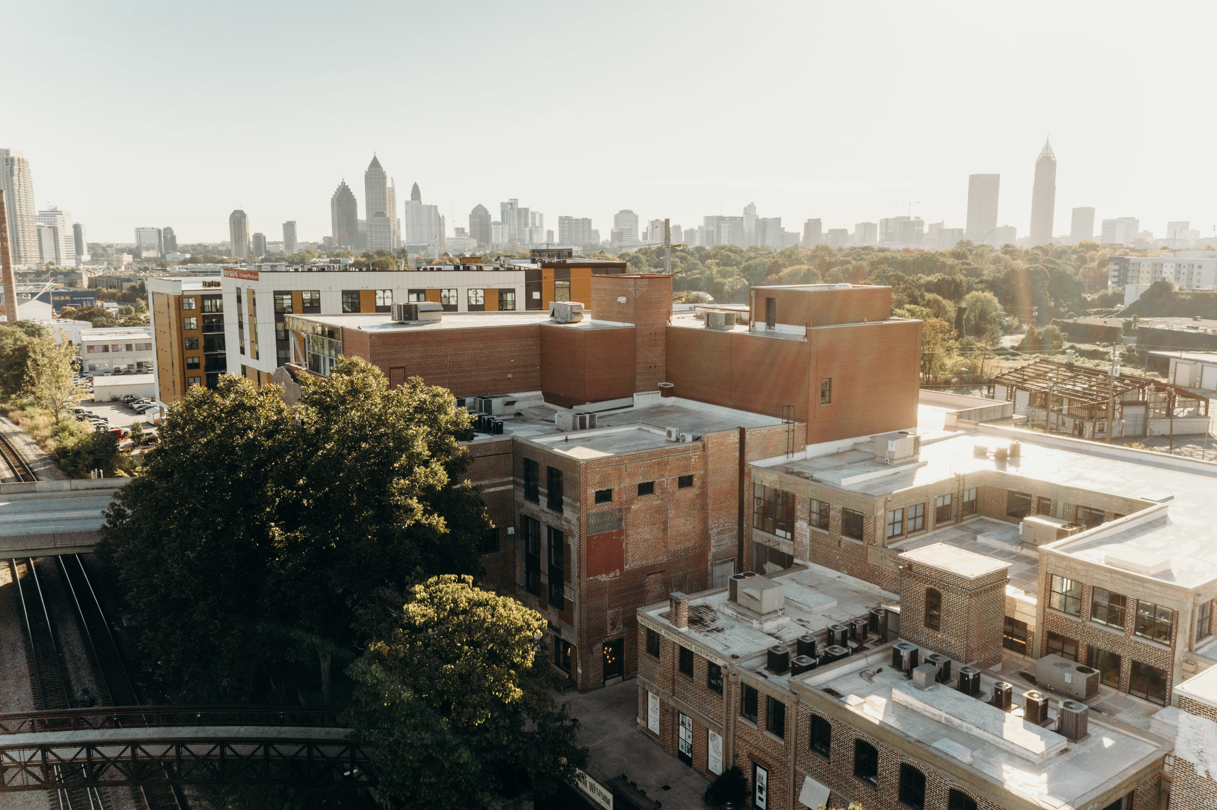 Aerial view of Westside Provisions District with Atlanta skyline in background