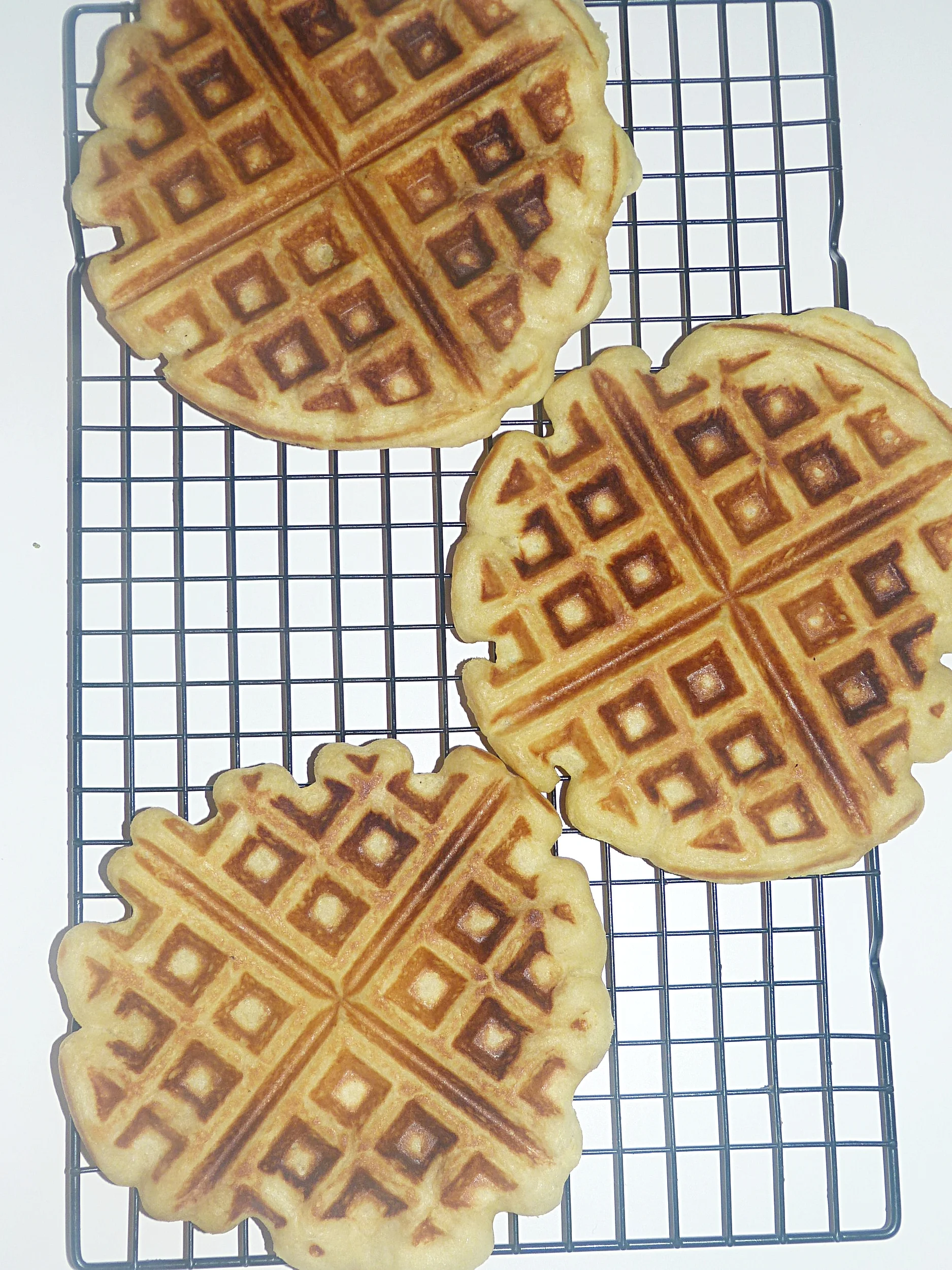 Placing fresh waffles one later deep on a cooling rack while the you cook the rest of the batter, keeps the outsides crispy.