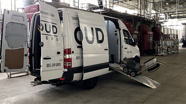 Our 20 HP pump being unloaded from our Mobile Service and Demo Sprinter Van.