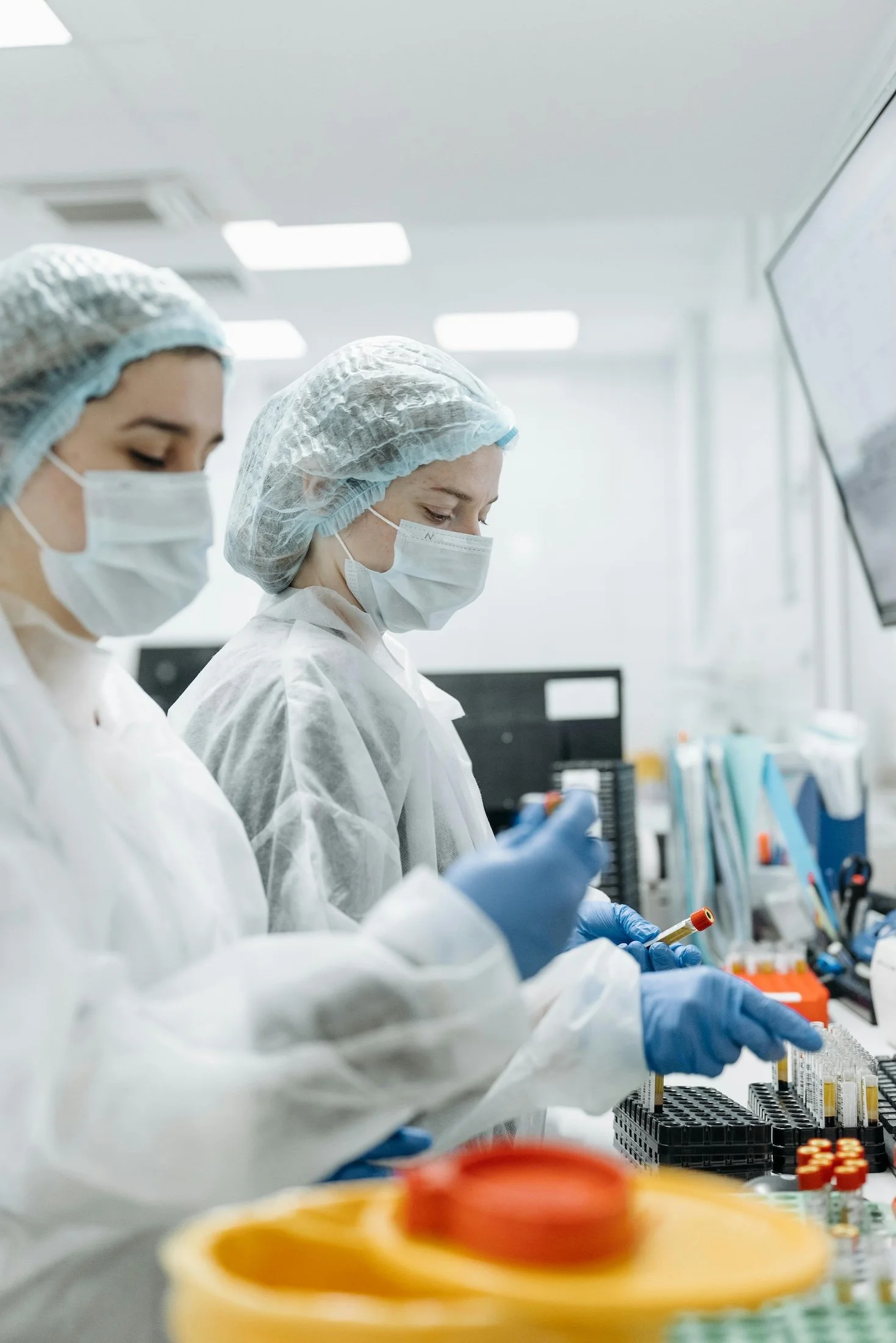 Scientists in a lab working with test tubes