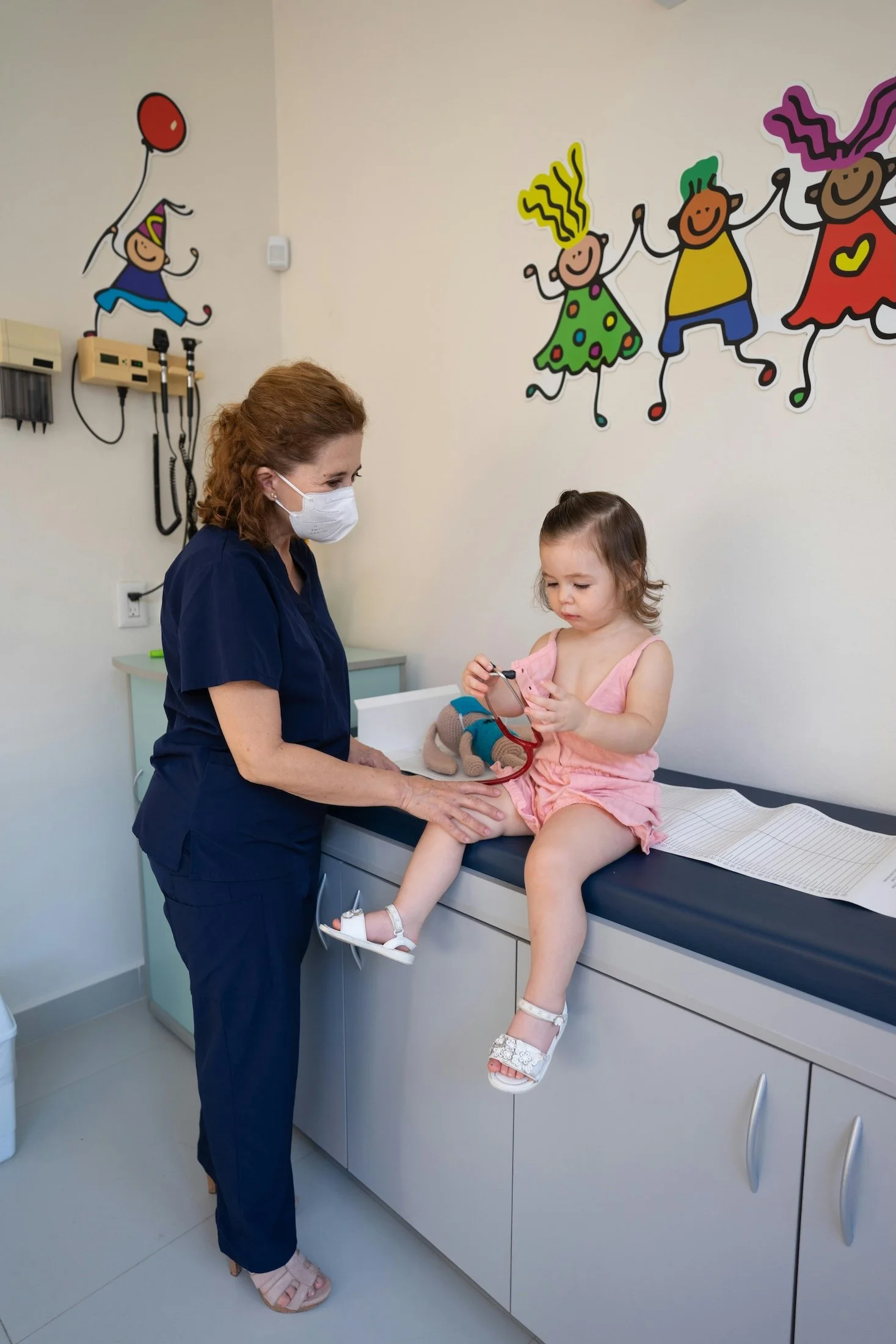 Doctor treating a child in a doctor's office