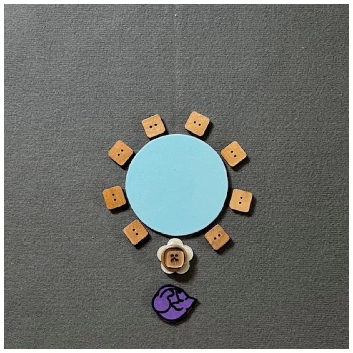 A round table with 8 chairs for attendees and one rolling chair for the presenter.