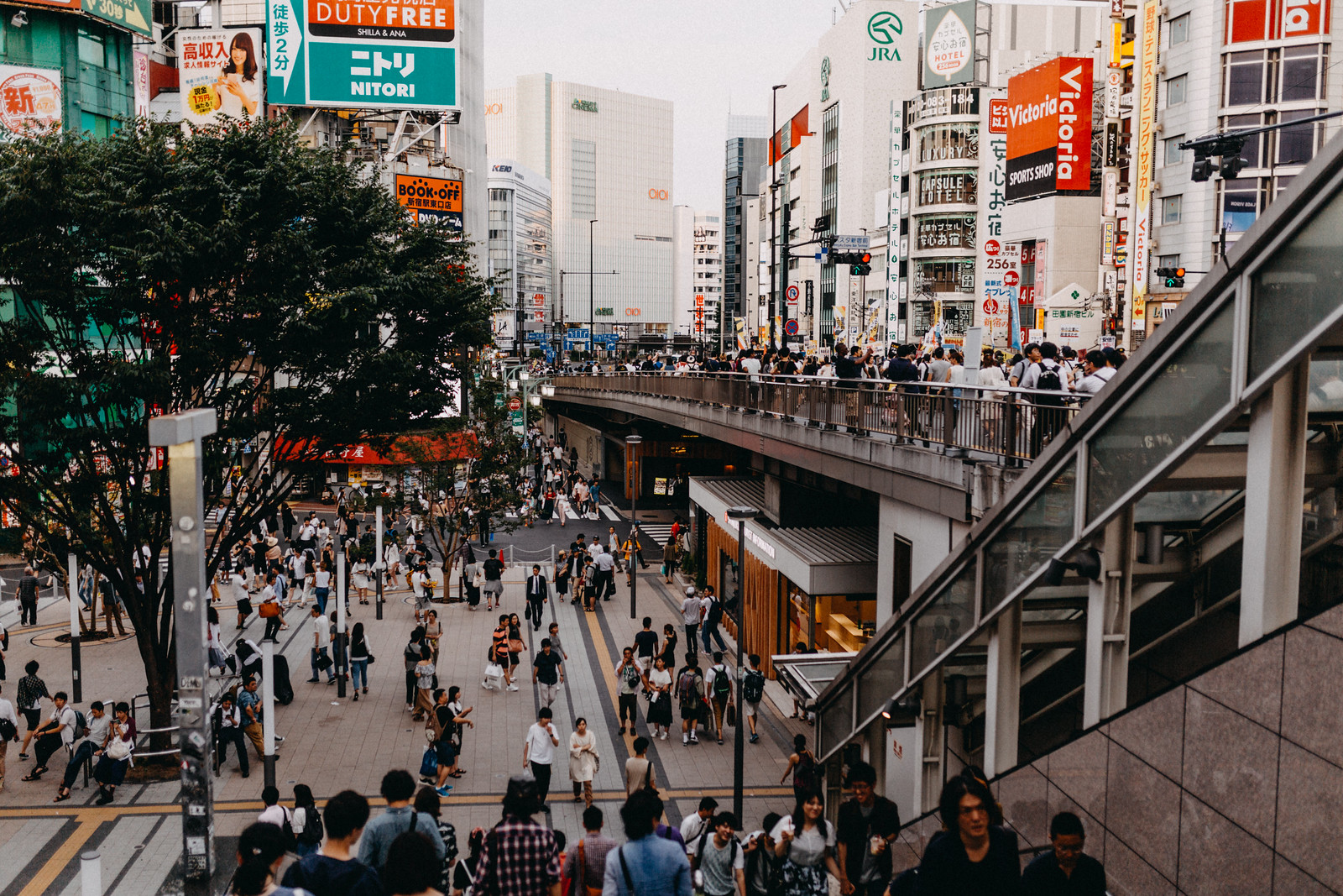 Crowded streets near Shinjuku Ku Central Station in Tokyo Japan