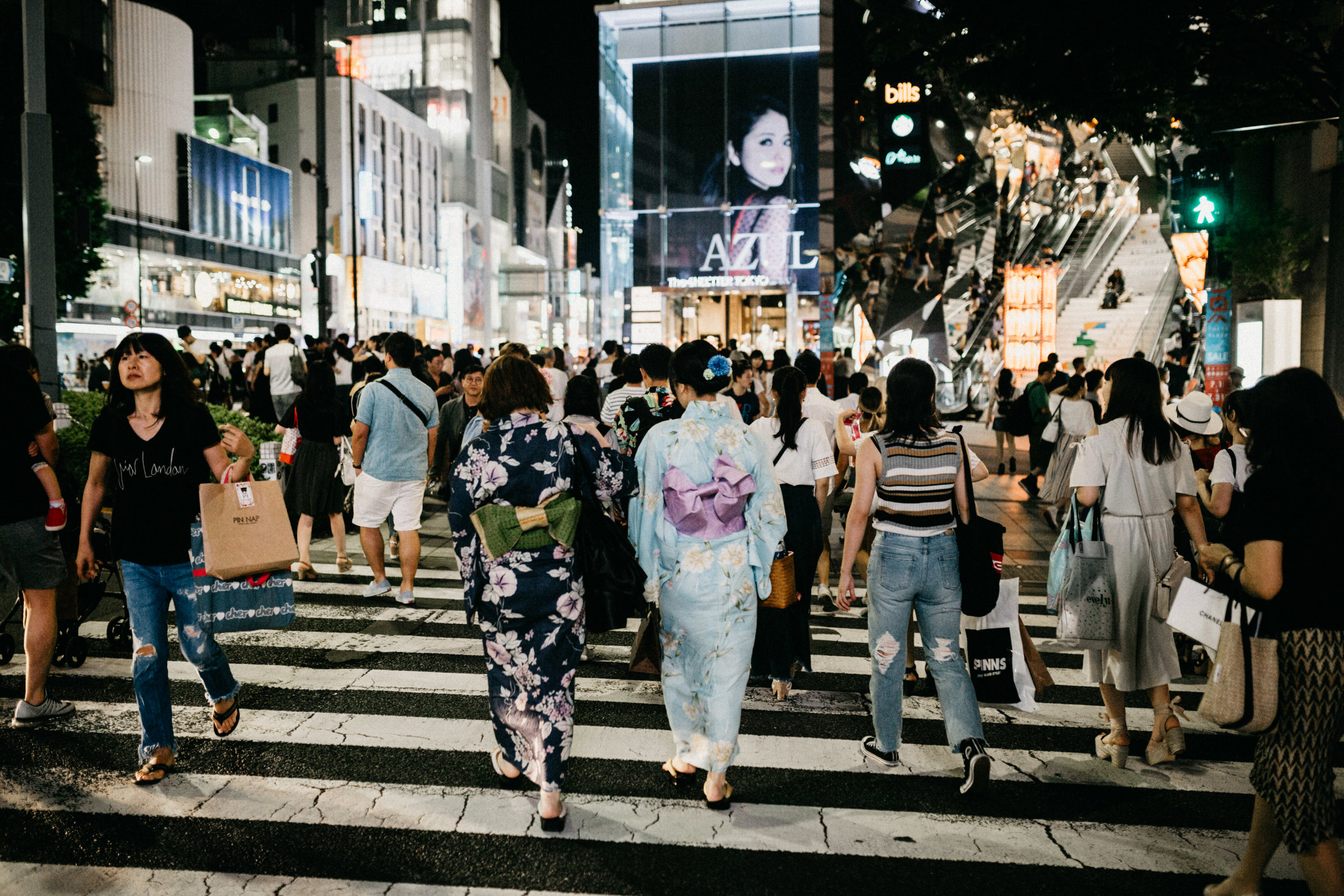 Japanese women dressed in traditional kimono crossing street in Harajuku Tokyo Japan