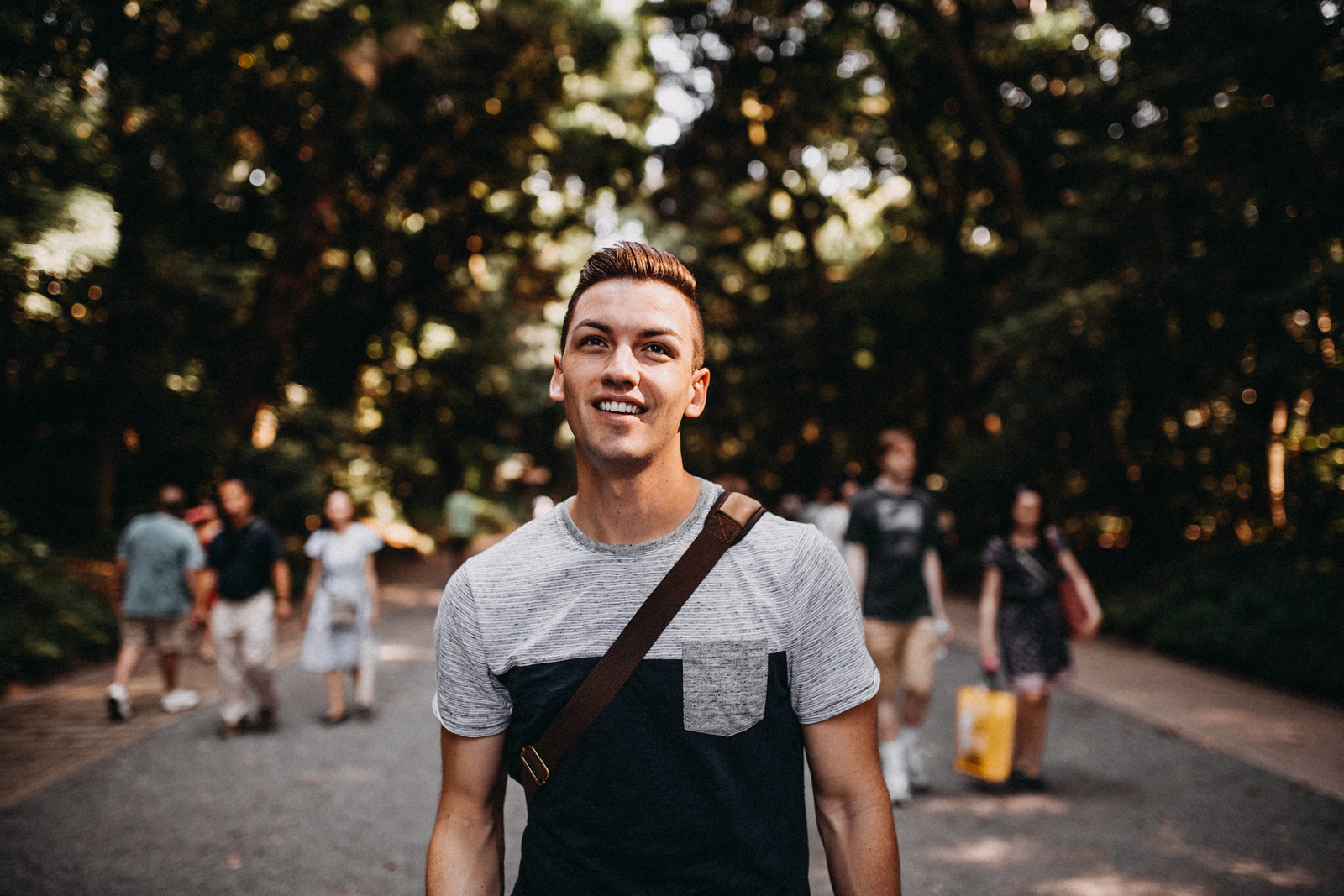 a tourist walking in Yoyogi Park to Meiji Jingu Shrine gay backpacker