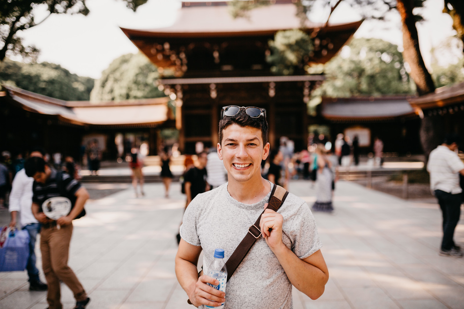 Gay backpacker Matthew exploring Meiji Jingu shrine in Yoyogi Park Tokyo Japan