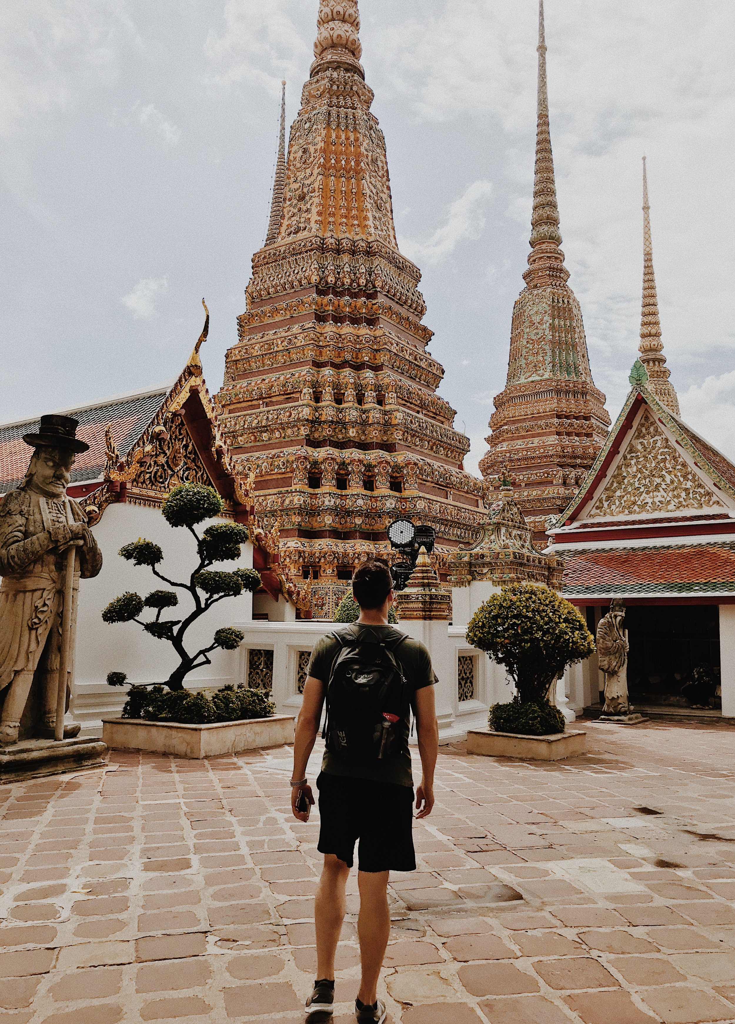 Man standing outside of Wat Pho.JPG