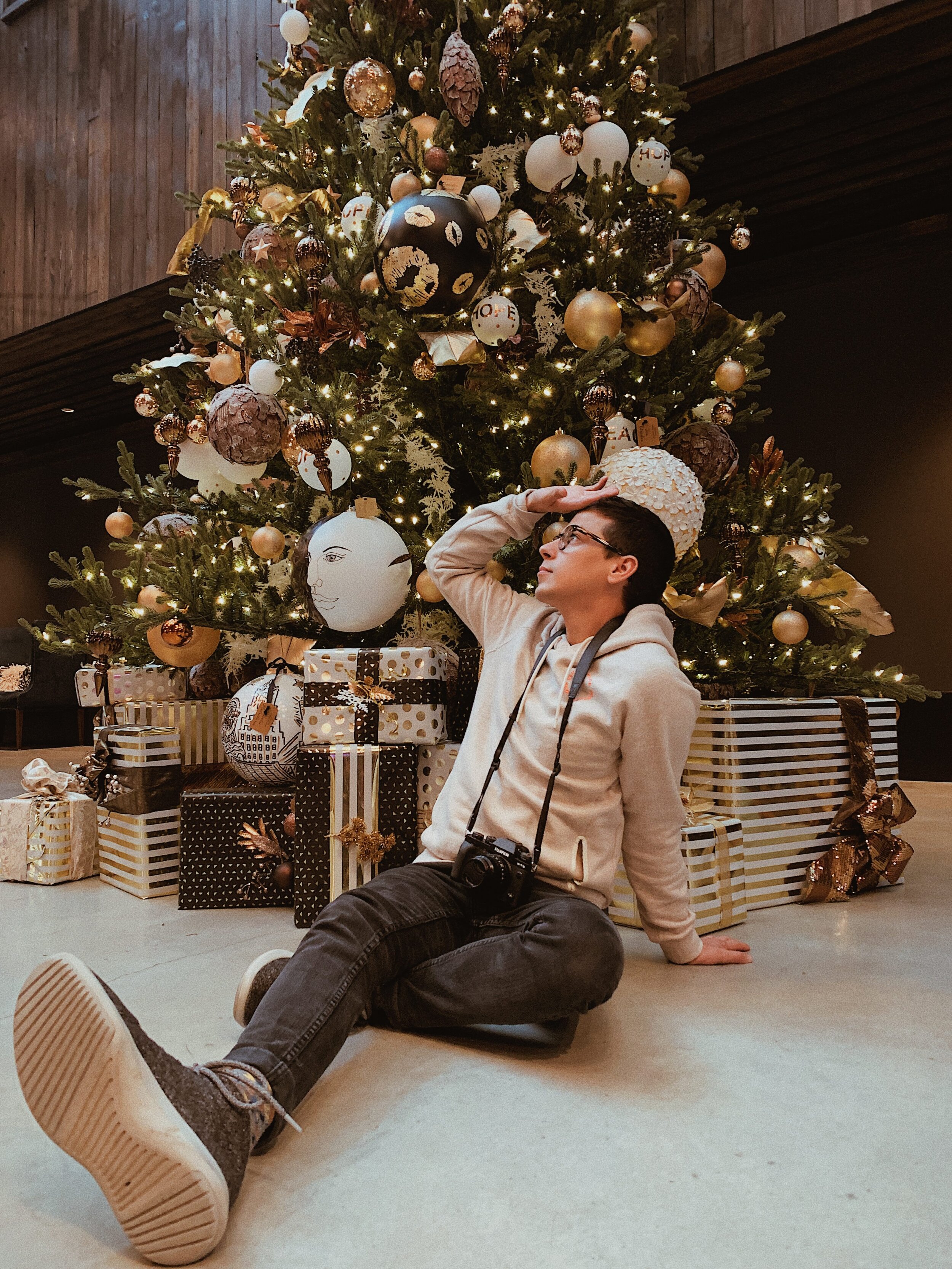 being dramatic in front of a Christmas Tree.JPG