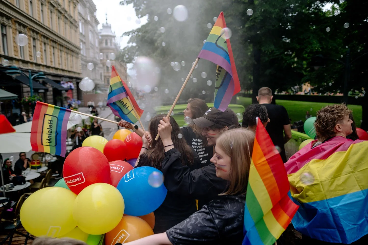 LGBTQ people on float celebrate Helsinki pride with flags.jpeg