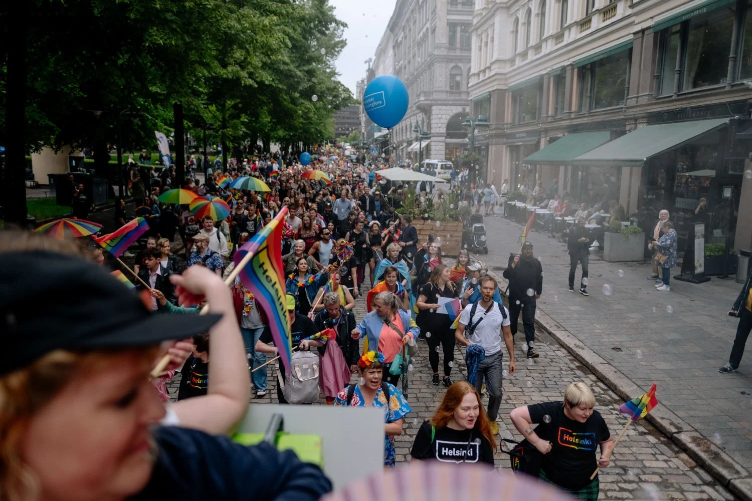 crowd in the street marching for helsinki pride.jpeg