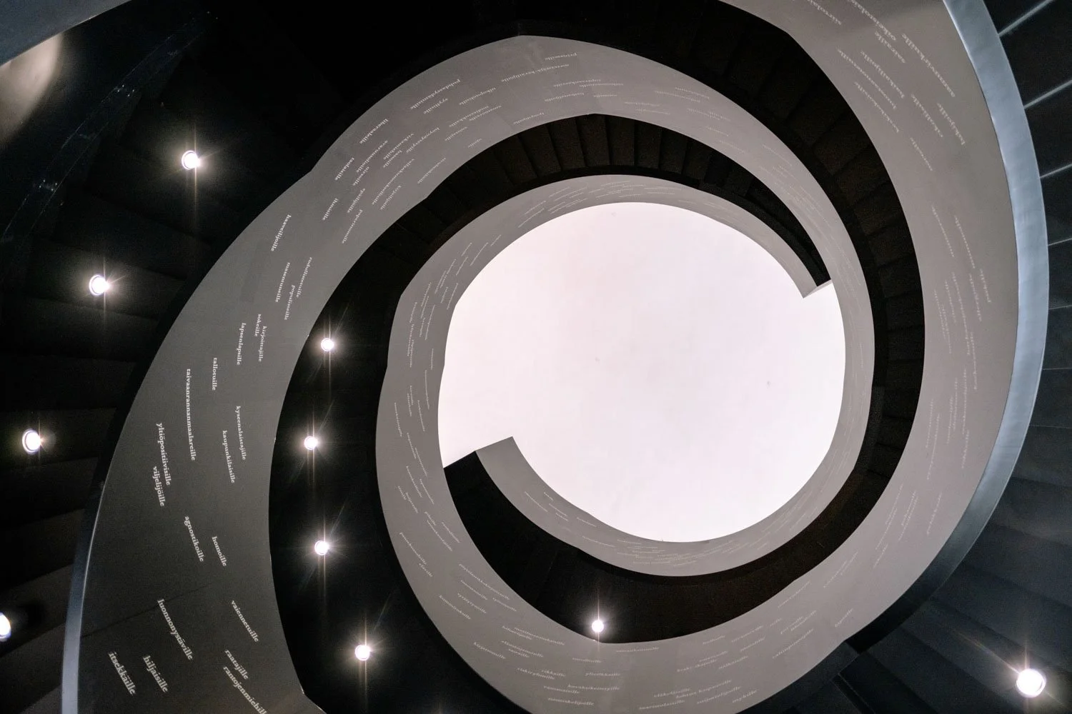 Looking up at spiral staircase in Oodi Library.jpeg