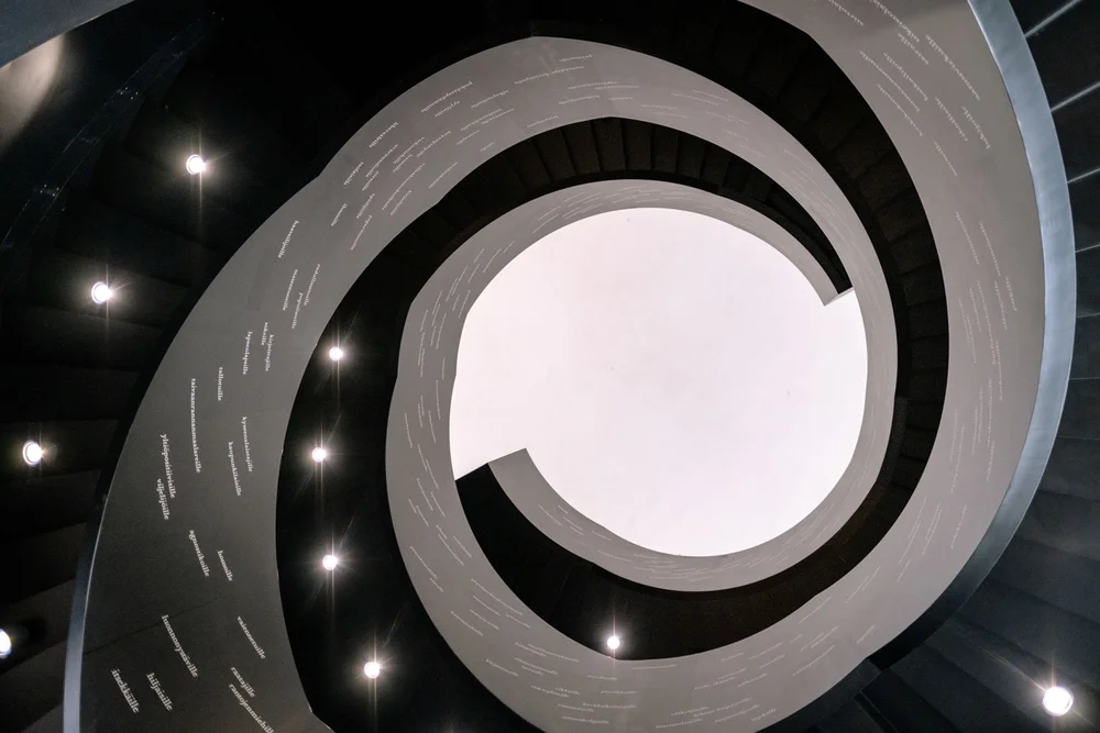 Looking up at spiral staircase in Oodi Library.jpeg