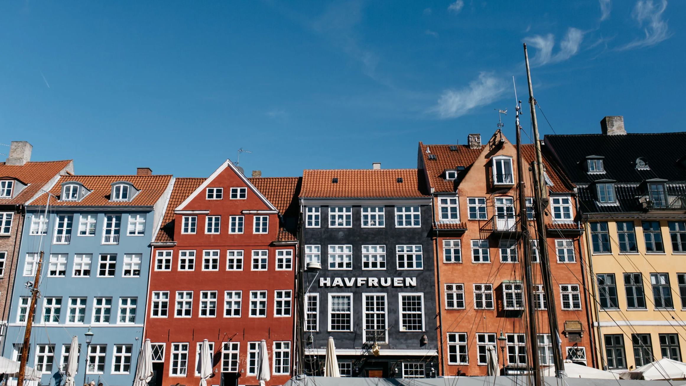 classic Danish brightly painted building facades in the Nyhavn district of Copenhagen Denmark