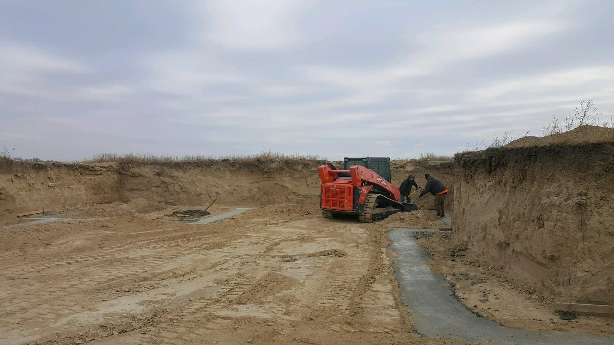  Removing excess dirt to level and square. 