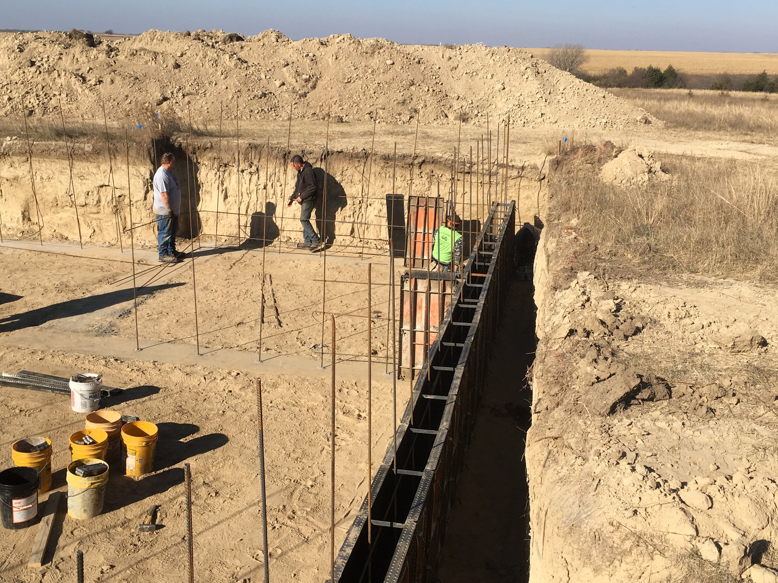  Eric is helping Clint with the rebar reinforcement. 