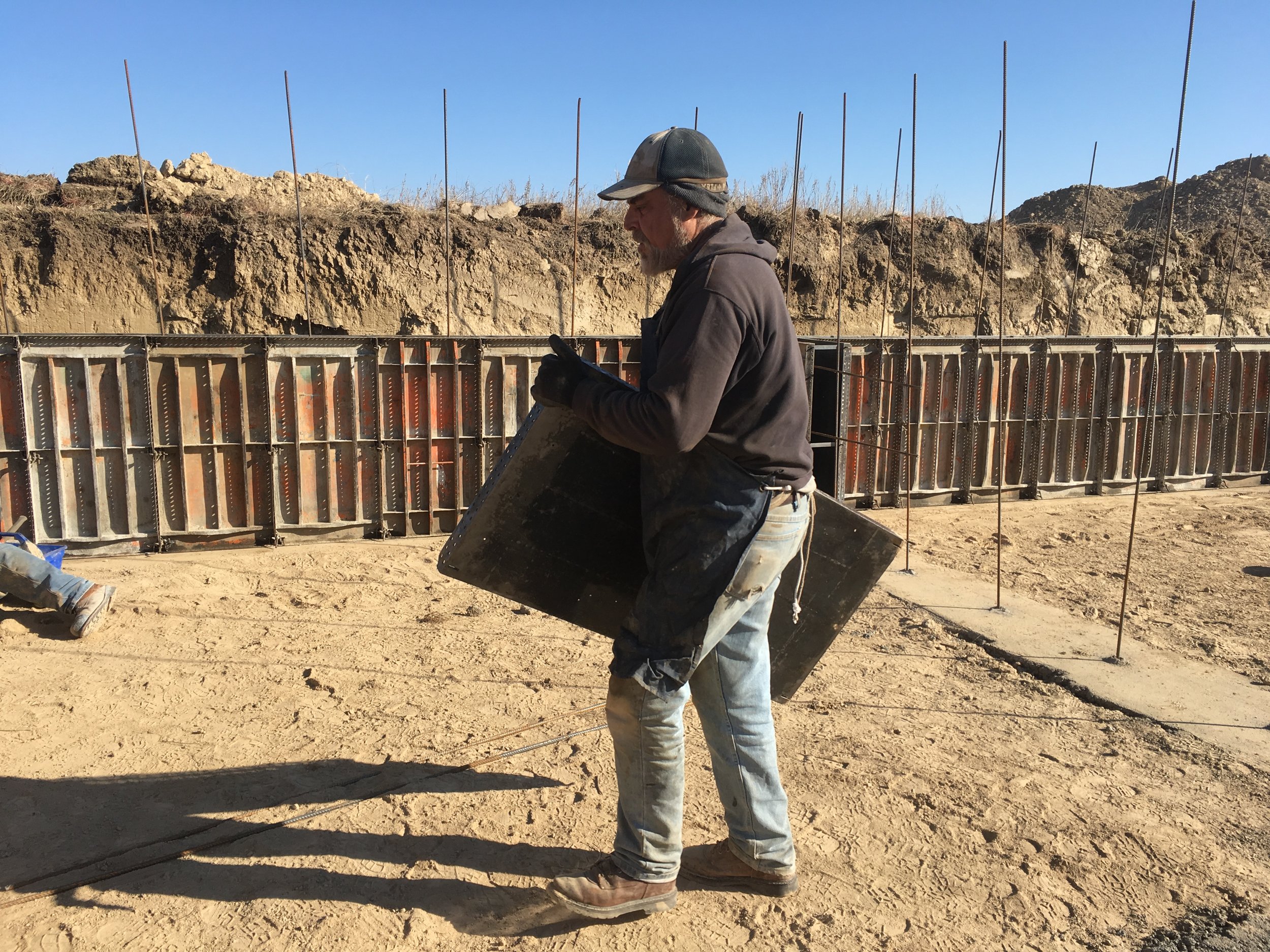  William is busy hauling forms from the trailer to the correct location. 