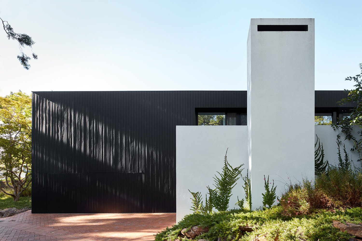Mitcham-House-Contemporary-Black-Timber-Home-Driveway Fireplace.jpeg