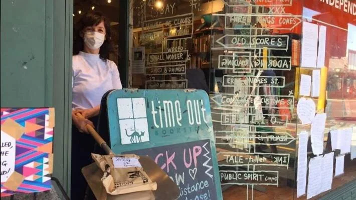 Auckland's Time Out Bookstore serves customers with pizza paddle.