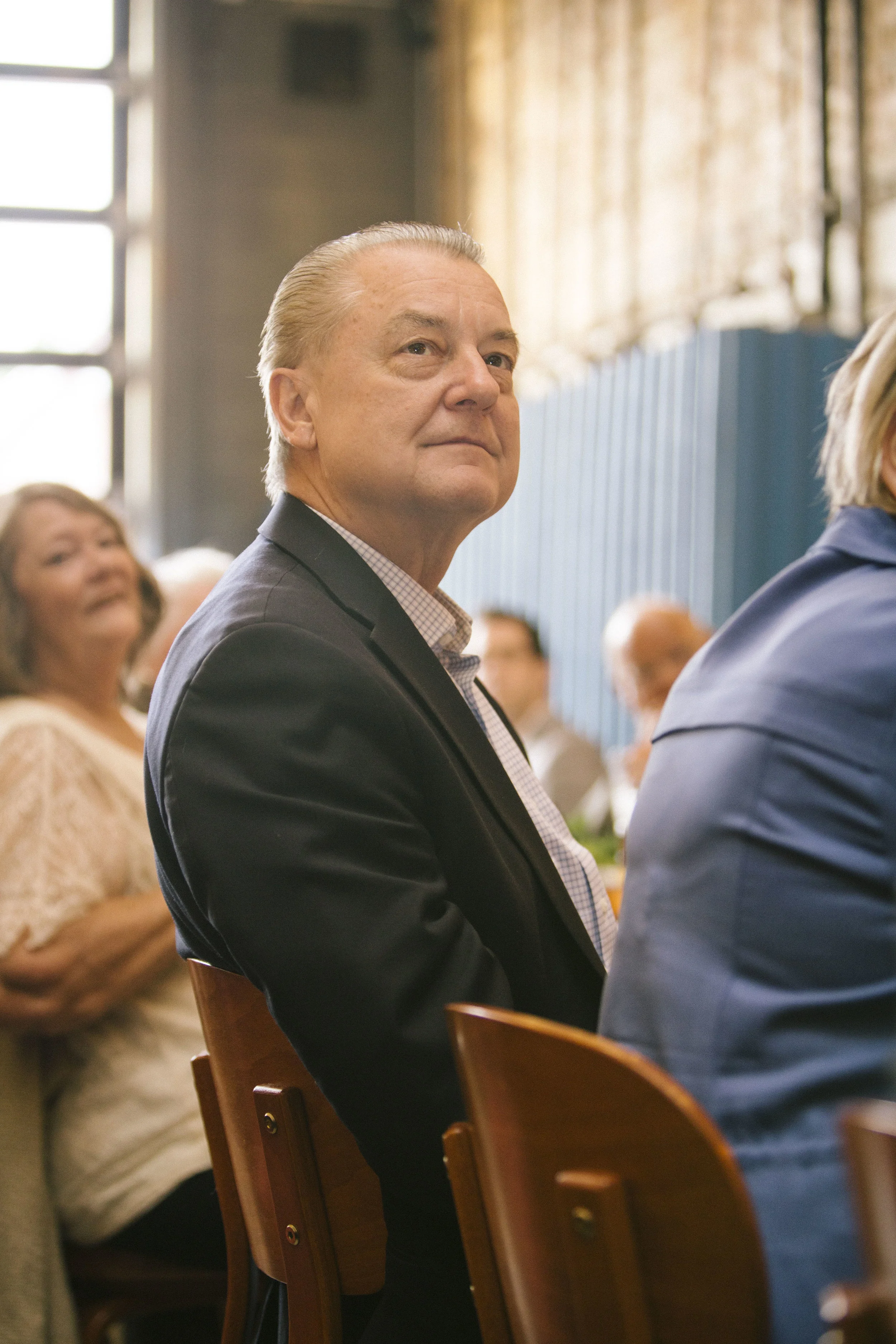 A man watches on during a ceremony/ event celebration in Chicago.