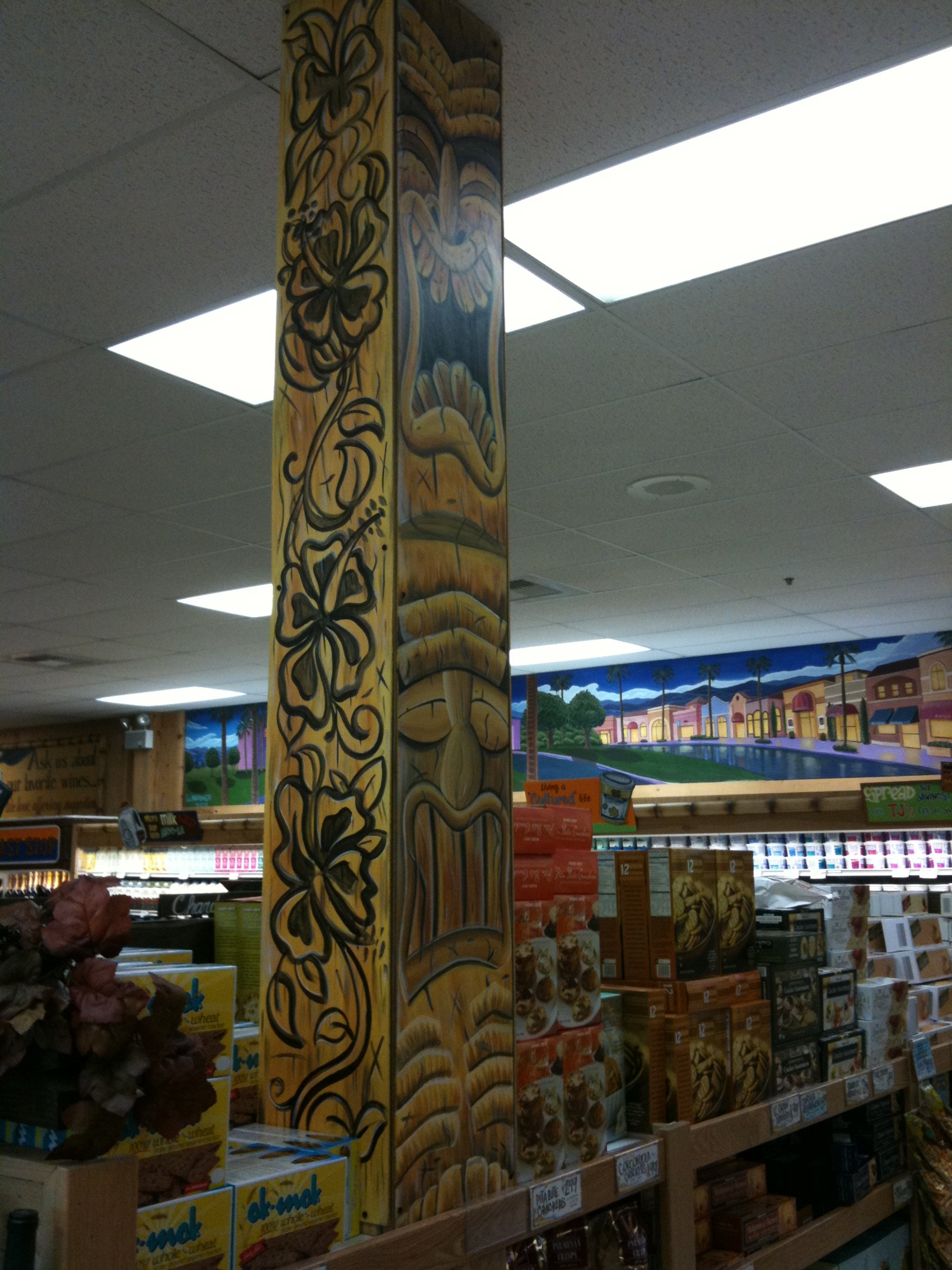  The tiki guy found a home in the wine section.  