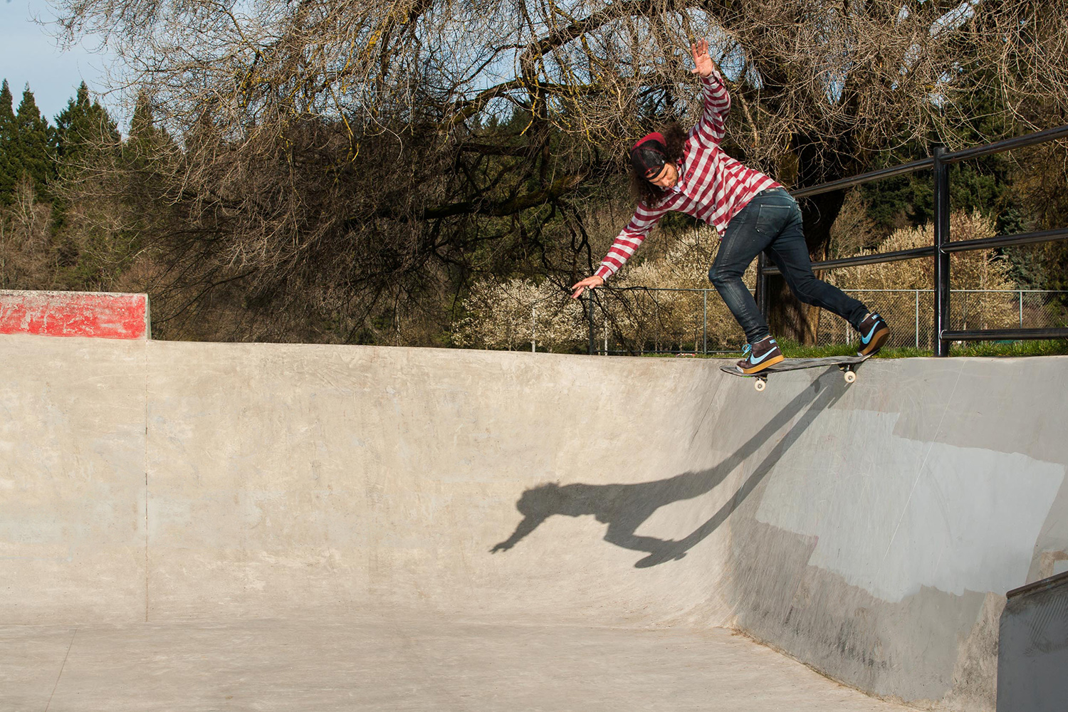  Al Partanen takes a backside tailslide into a rarely skated section of Pier Park Skatepark’s street area. 