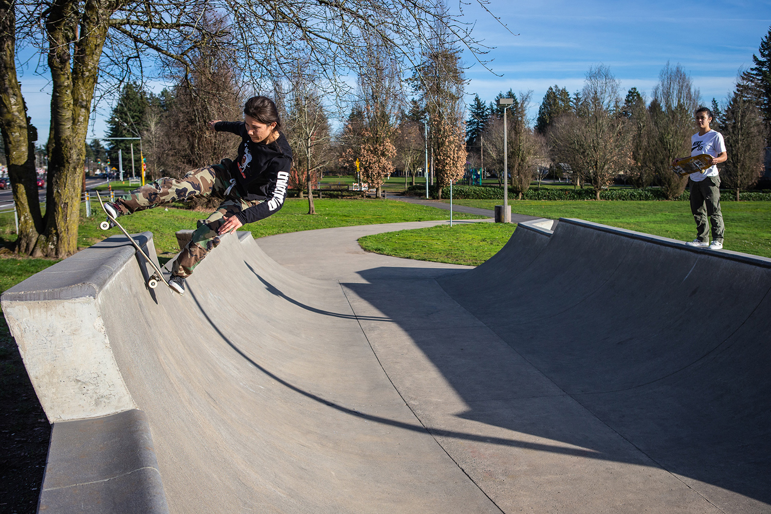  Micaela Profit rocks to fakie upon the pool block coping at Ed Benedict Skate Plaza. 