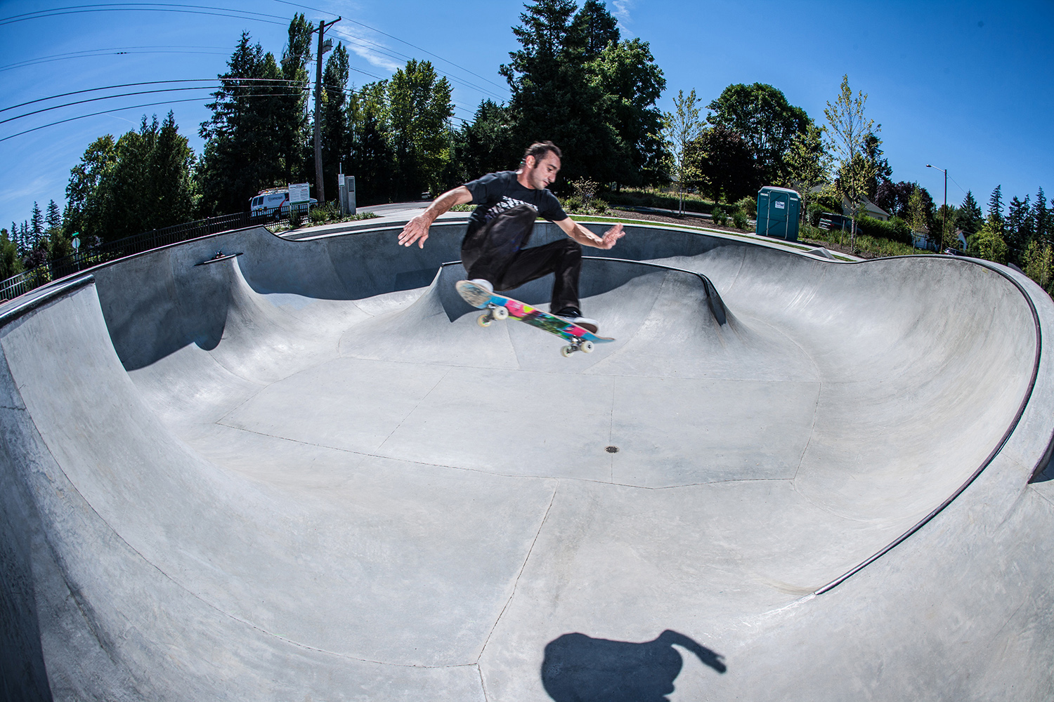  Professional skater Daniel Cardone ollies across two distant transitions at the Holly Farm Skate Spot. 