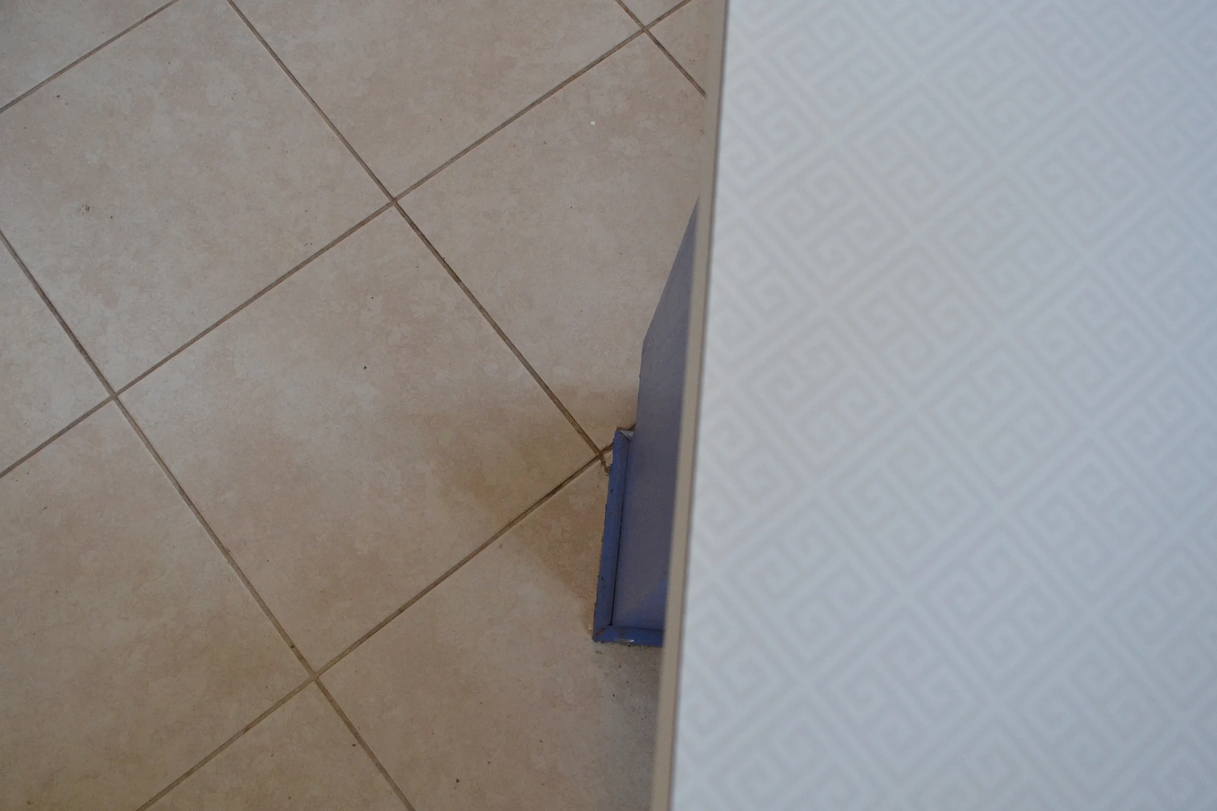 white countertop beige tile floor.jpg