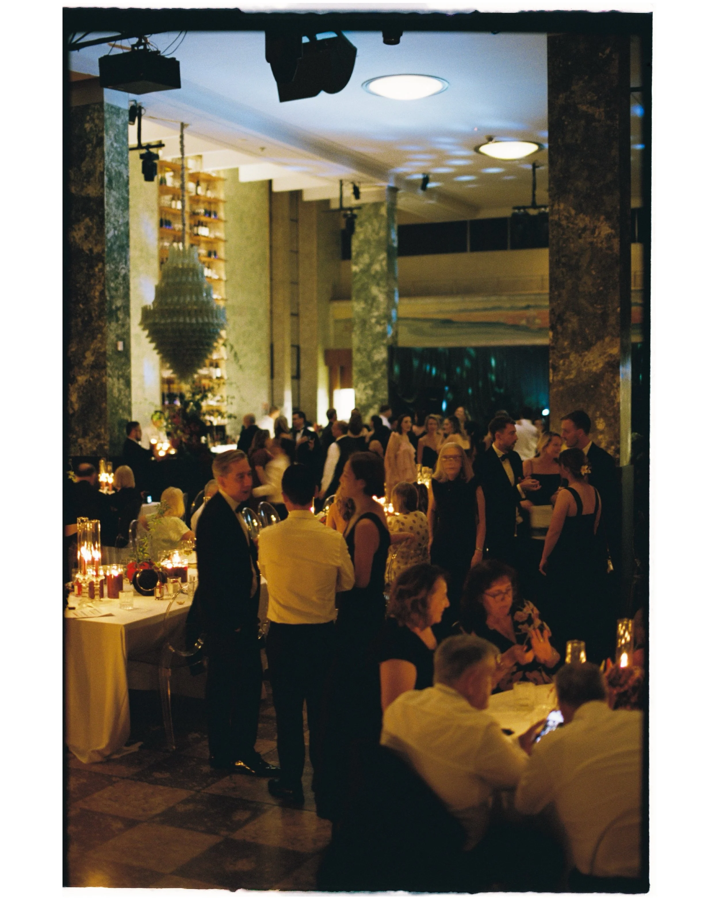 Katie &amp; Louis&rsquo; art gallery wedding reception on film 

The brief embraced the richly cinematic and romantic as the grand hall of the Museum of Contemporary Art was transformed for the evening. Illuminated by thousands of warm candles, table
