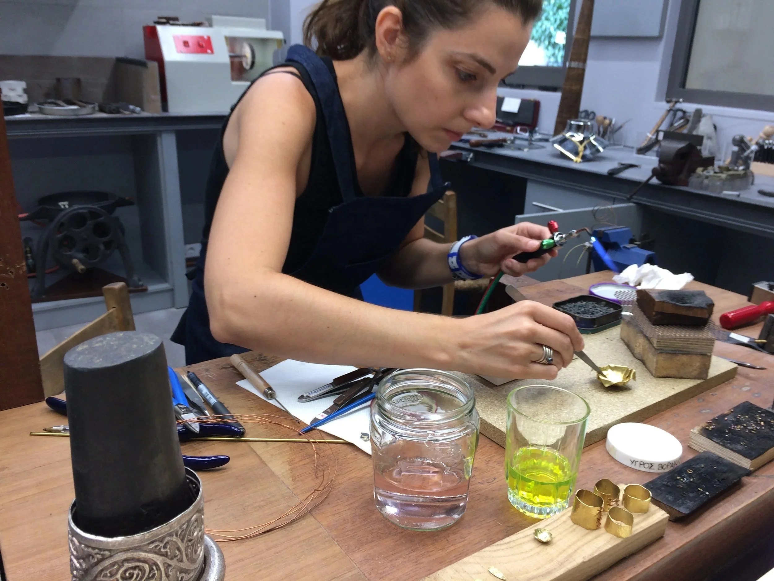A jewelry artist at work in the metalsmithing studio of the Ilias Lalaounis Jewelry Museum