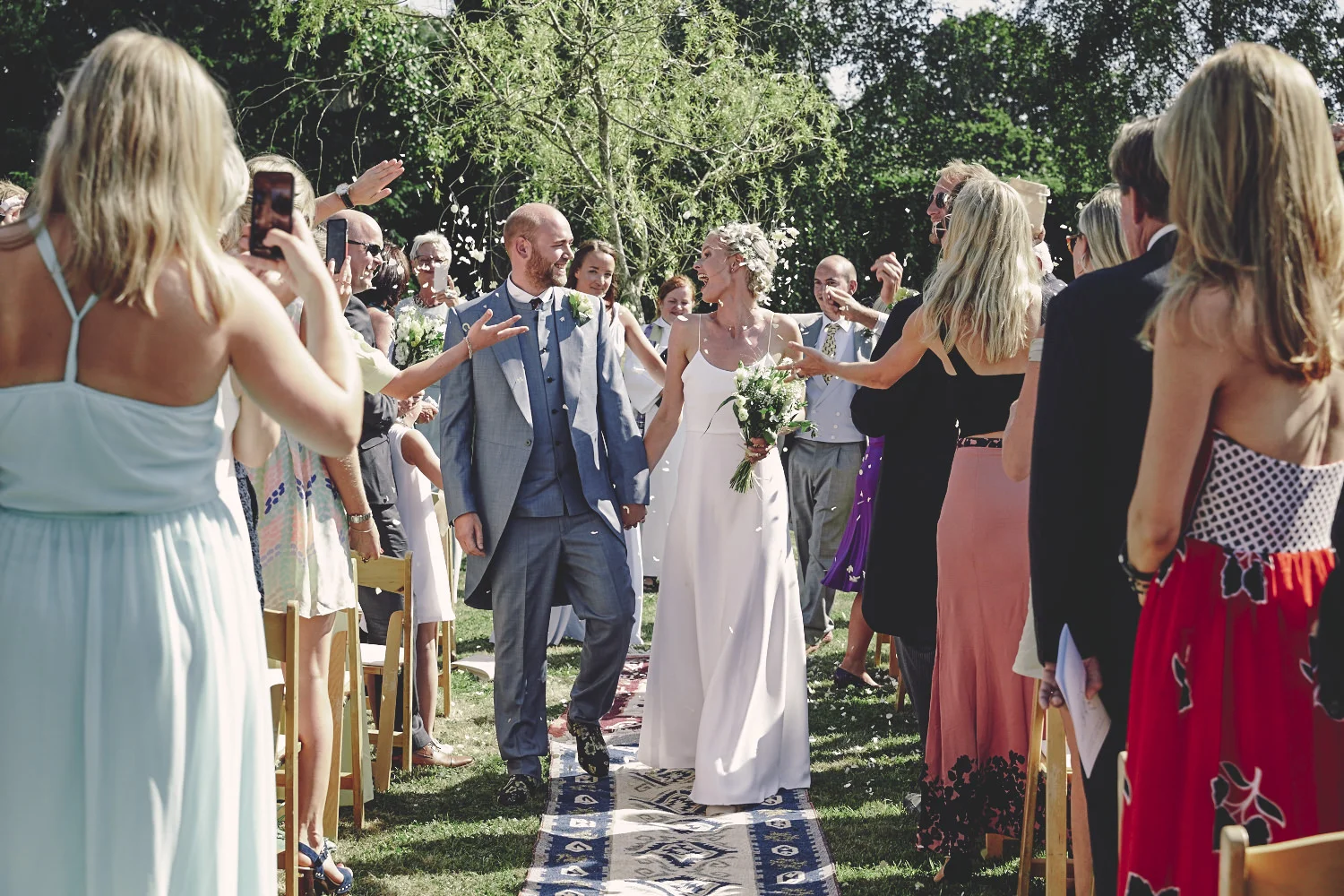Boho Bride and Groom walking down the aisle, Kent