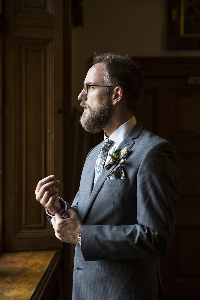Groom gazing out of the window, Orchardleigh Estate