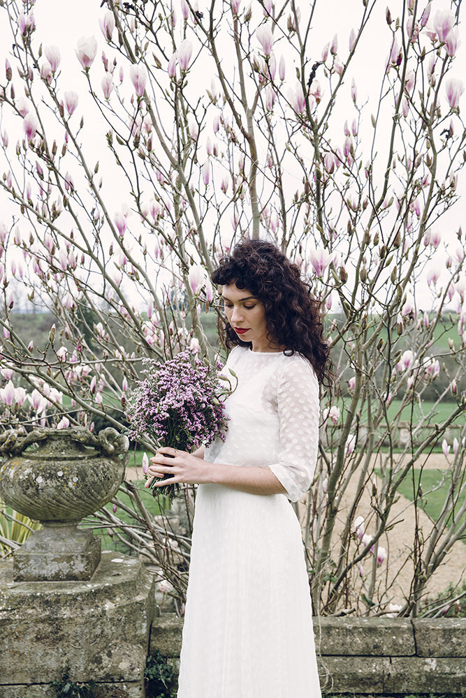 Bridal portrait against magnolia tree in the Orchardleigh Estate gardens