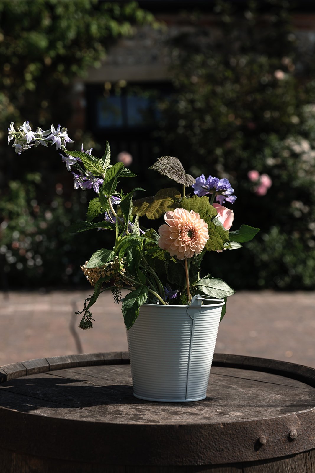 Floral display in a metal bucket 