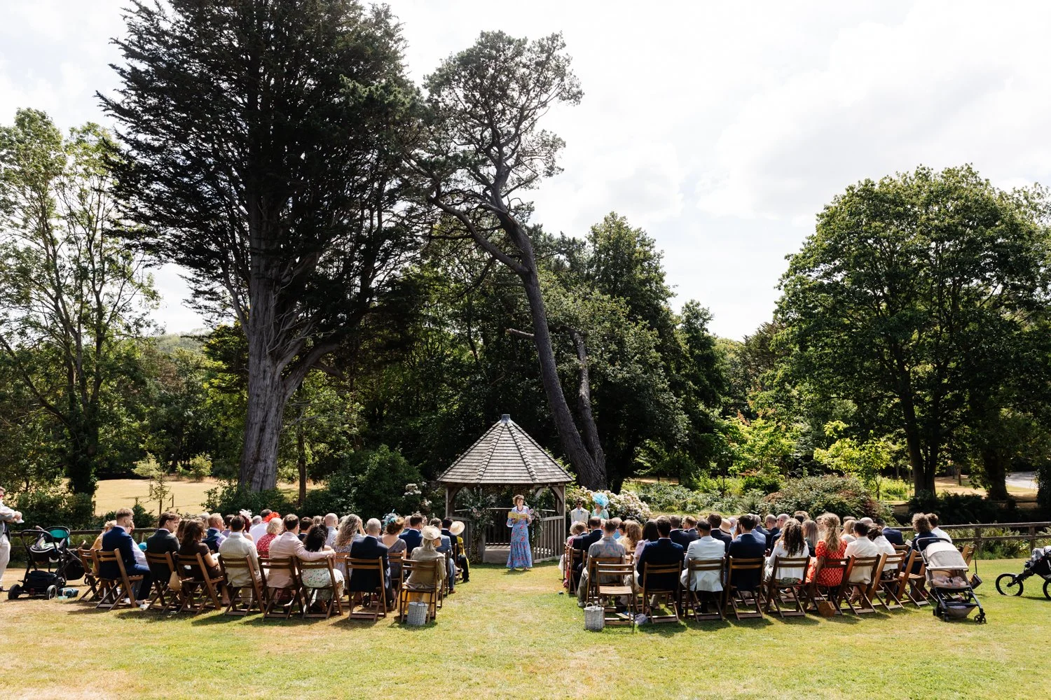 Guests watching a wedding ceremony at Knowle Manor