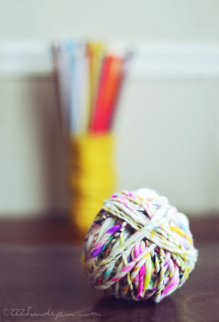 Handspun art yarn and knitting needles