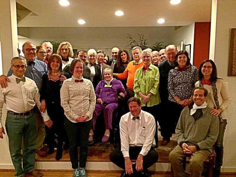 John and Sally at a Buyer’s Edge gathering. John is in his signature bow-tie and bright orange sweater.
