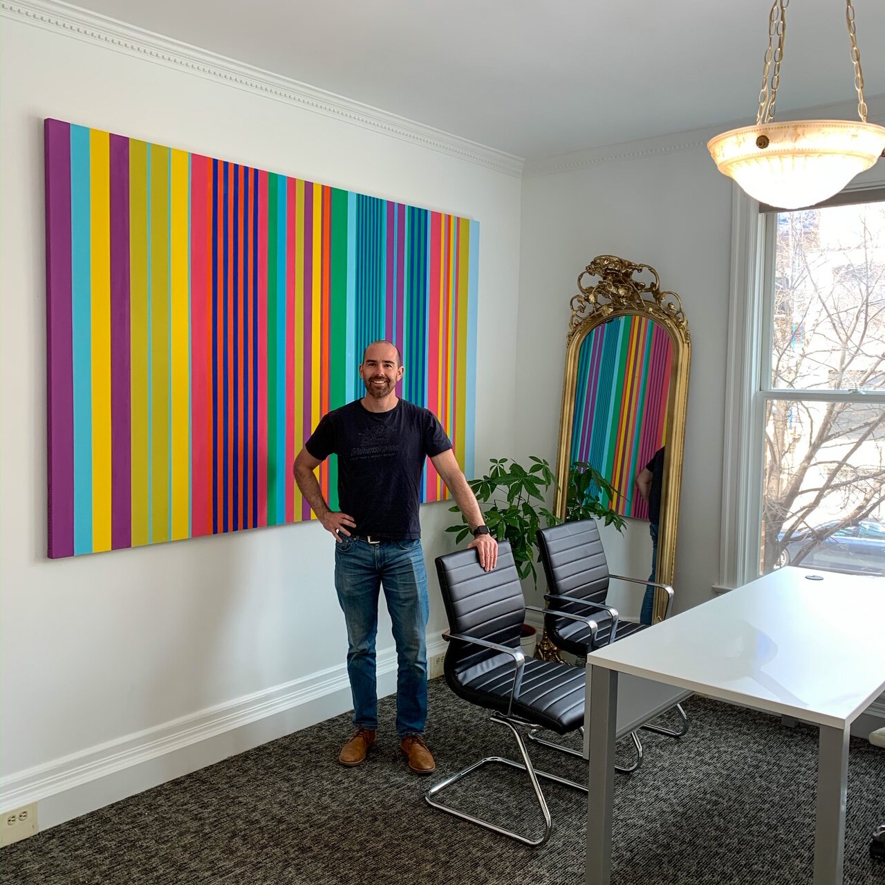 Own Ben Stern in front of Sue's artwork Buyer's Edge Dupont DC buyers agent real estate office.JPG