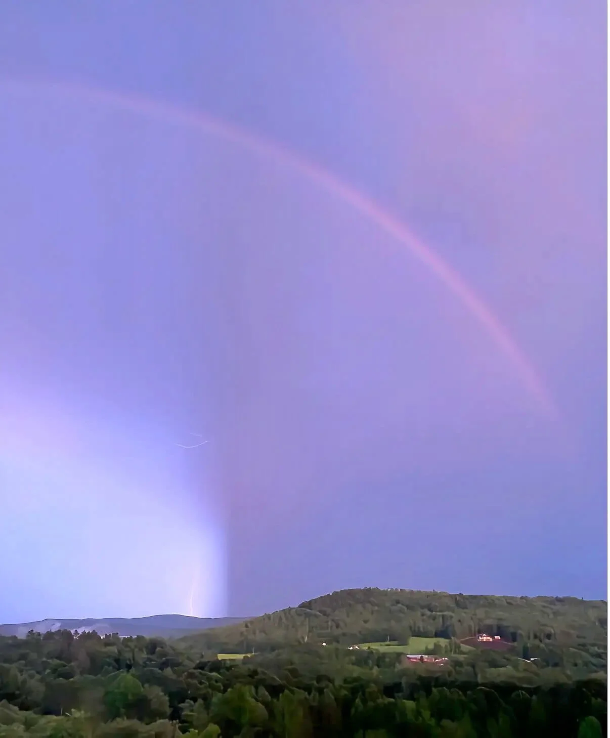 Luxury Vermont second home with mountain views beneath a purple lightning sky and rainbow represented by Buyer’s Edge | BuyersAgent.com for Washington DC area buyers seeking legacy properties and rural retreats.