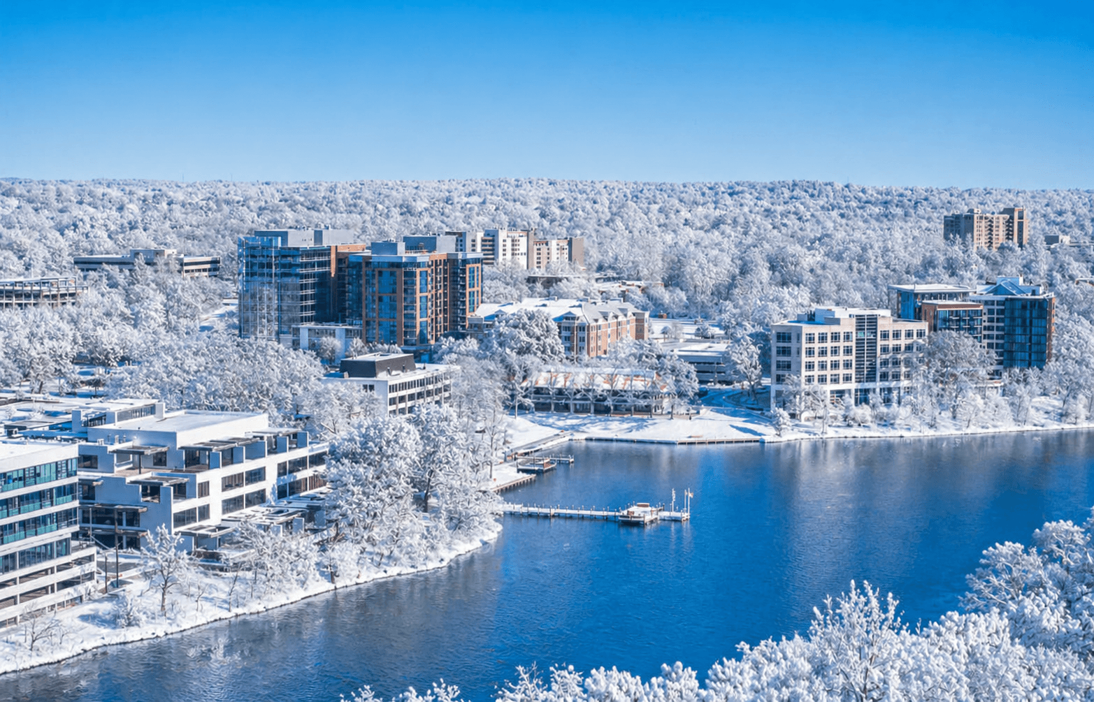 Snow-covered lakefront view of Howard County MD with luxury homes, condos, waterfront living, and sought-after neighborhoods for homebuyers in Maryland